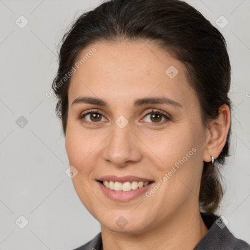 Joyful white young-adult female with medium  brown hair and brown eyes