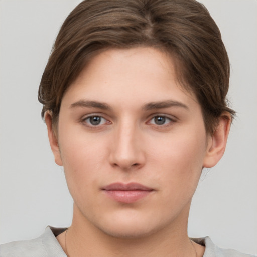 Neutral white young-adult female with short  brown hair and brown eyes