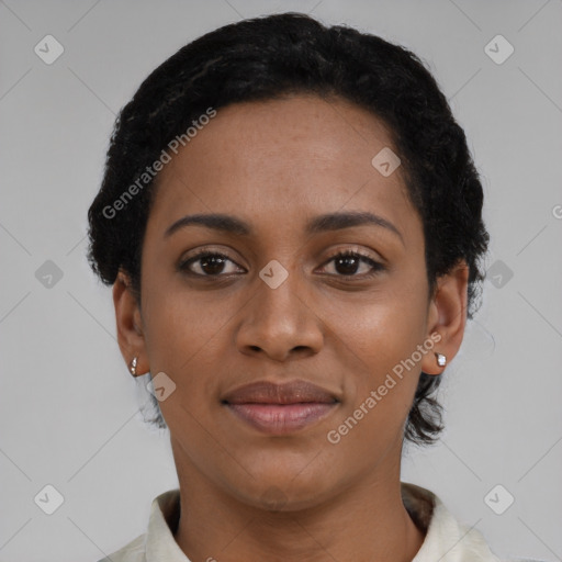 Joyful black young-adult female with short  black hair and brown eyes