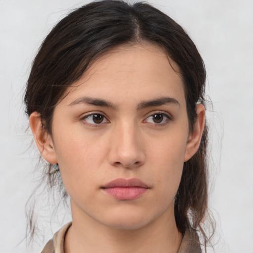 Neutral white young-adult female with medium  brown hair and brown eyes