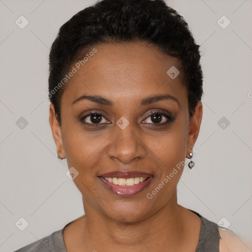 Joyful black young-adult female with short  black hair and brown eyes