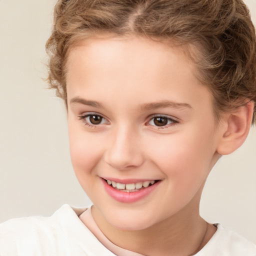 Joyful white child female with short  brown hair and brown eyes