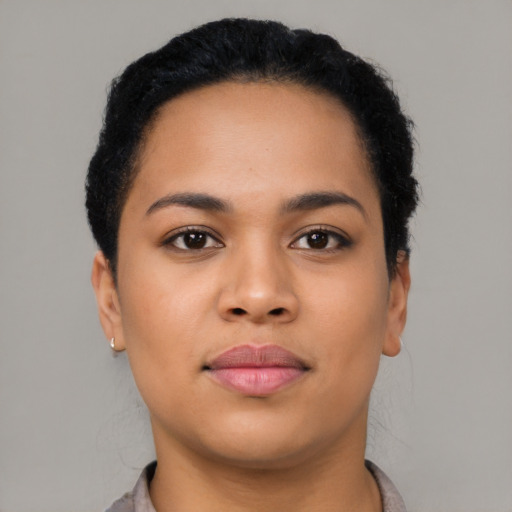 Joyful asian young-adult female with short  black hair and brown eyes