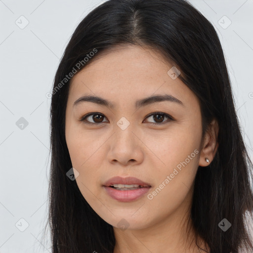 Joyful asian young-adult female with long  brown hair and brown eyes