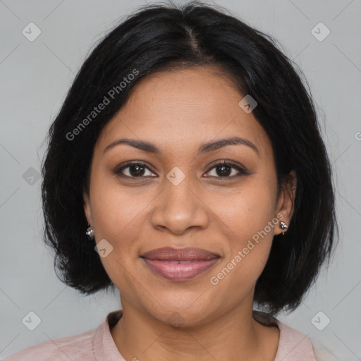 Joyful black adult female with medium  brown hair and brown eyes