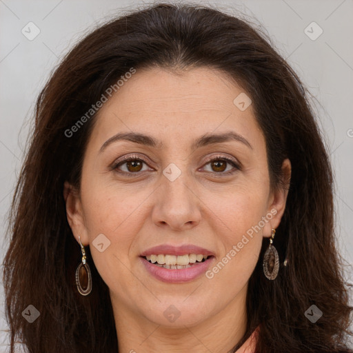 Joyful white adult female with long  brown hair and brown eyes