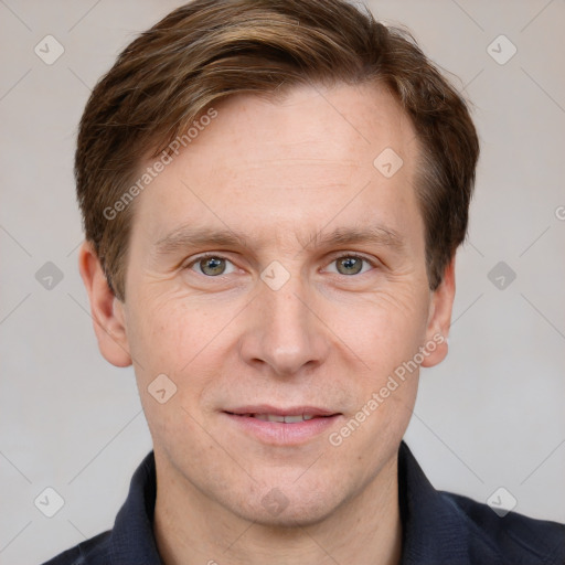 Joyful white adult male with short  brown hair and grey eyes