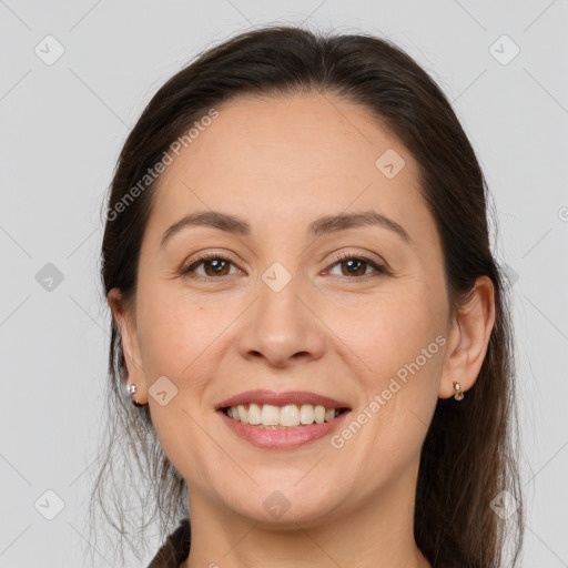 Joyful white young-adult female with long  brown hair and brown eyes