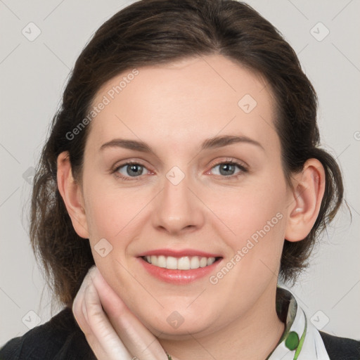 Joyful white young-adult female with medium  brown hair and green eyes