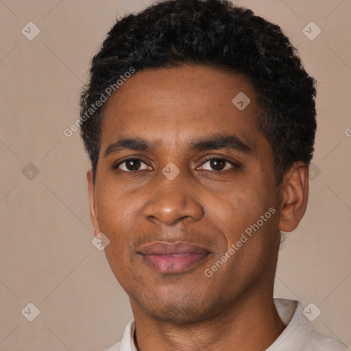 Joyful black young-adult male with short  black hair and brown eyes
