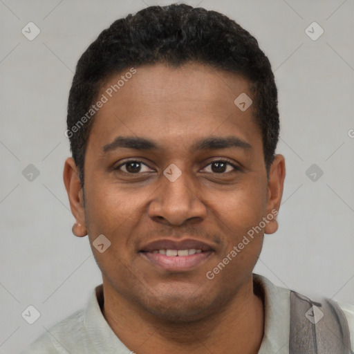 Joyful latino young-adult male with short  black hair and brown eyes