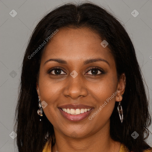 Joyful black young-adult female with long  brown hair and brown eyes