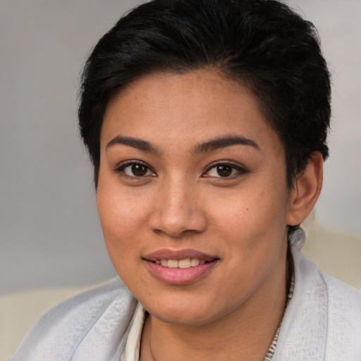 Joyful white young-adult female with short  brown hair and brown eyes