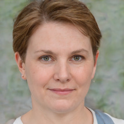 Joyful white adult female with short  brown hair and grey eyes