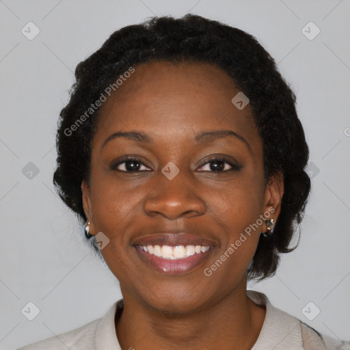 Joyful black young-adult female with medium  black hair and brown eyes