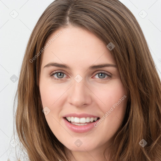 Joyful white young-adult female with long  brown hair and green eyes