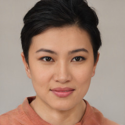 Joyful asian young-adult female with short  brown hair and brown eyes