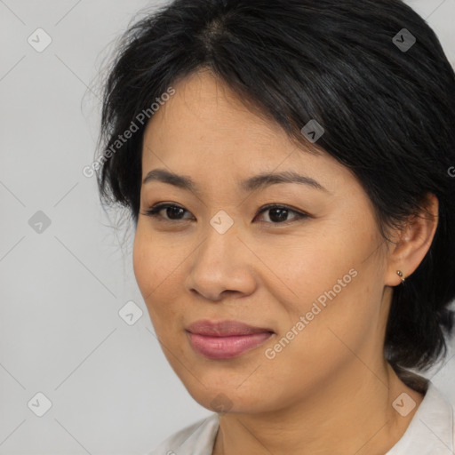 Joyful asian young-adult female with medium  black hair and brown eyes