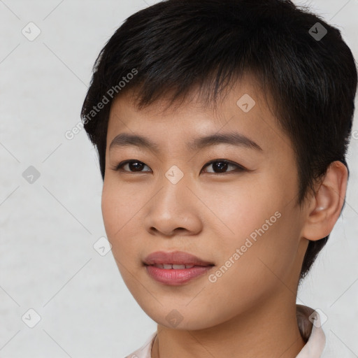 Joyful asian young-adult male with short  brown hair and brown eyes