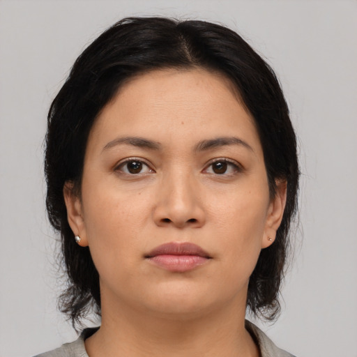 Neutral asian young-adult female with medium  brown hair and brown eyes