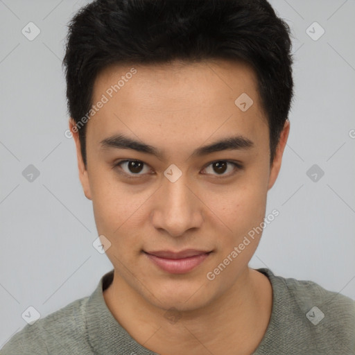 Joyful asian young-adult male with short  black hair and brown eyes