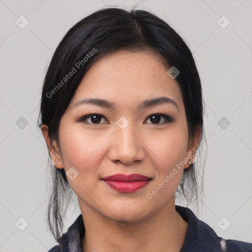 Joyful asian young-adult female with medium  black hair and brown eyes