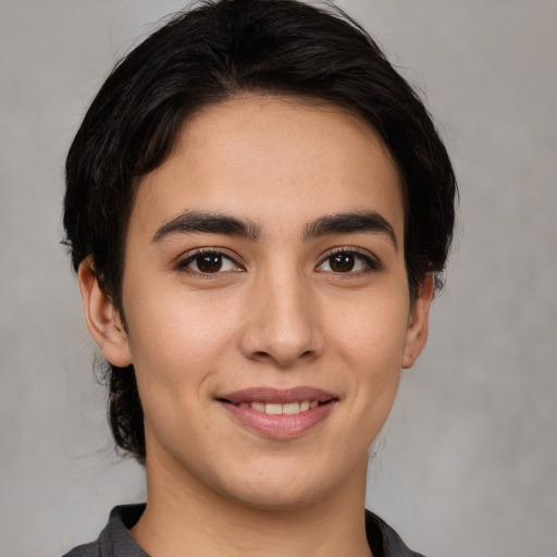 Joyful white young-adult male with medium  brown hair and brown eyes