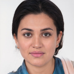 Joyful white young-adult female with medium  brown hair and brown eyes