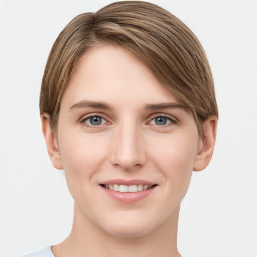 Joyful white young-adult female with short  brown hair and grey eyes