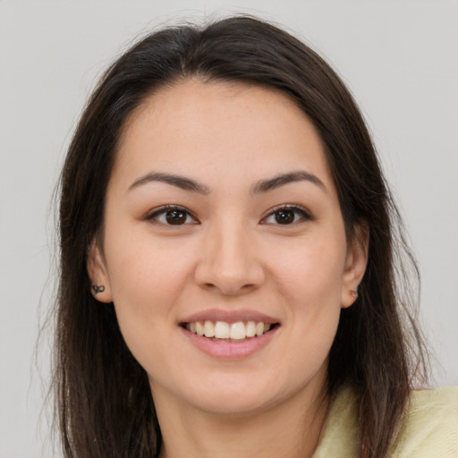 Joyful white young-adult female with medium  brown hair and brown eyes