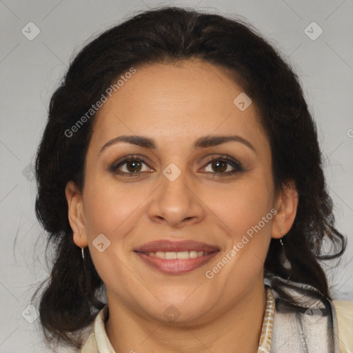 Joyful latino adult female with medium  brown hair and brown eyes