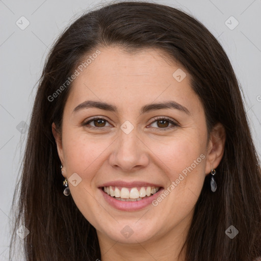 Joyful white young-adult female with long  brown hair and brown eyes