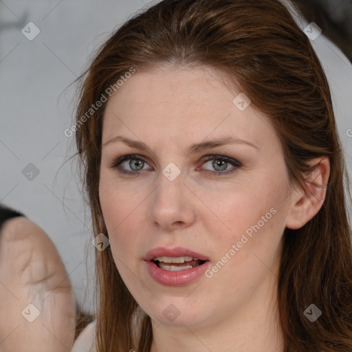 Joyful white adult female with medium  brown hair and grey eyes