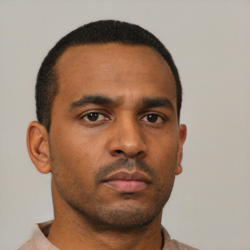 Neutral latino young-adult male with short  brown hair and brown eyes