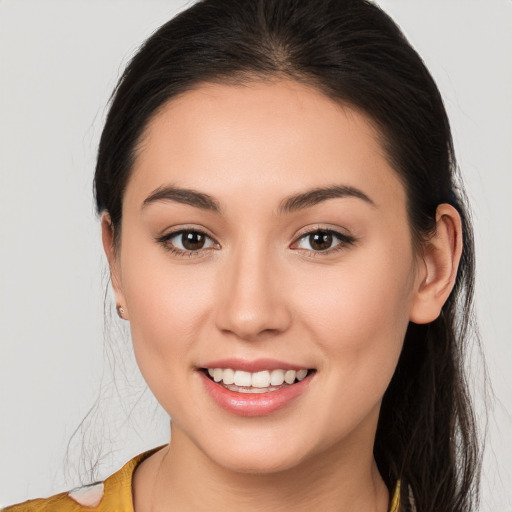 Joyful white young-adult female with medium  brown hair and brown eyes