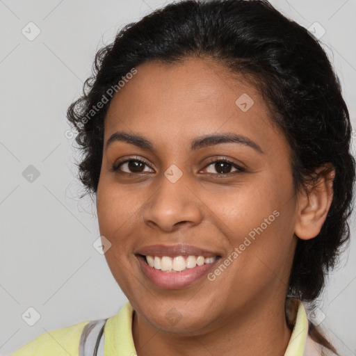 Joyful latino young-adult female with medium  brown hair and brown eyes