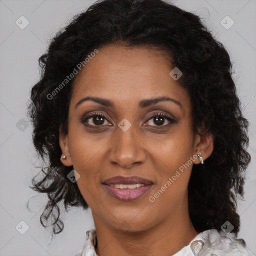 Joyful black adult female with medium  brown hair and brown eyes