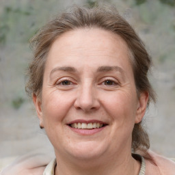 Joyful white adult female with medium  brown hair and grey eyes