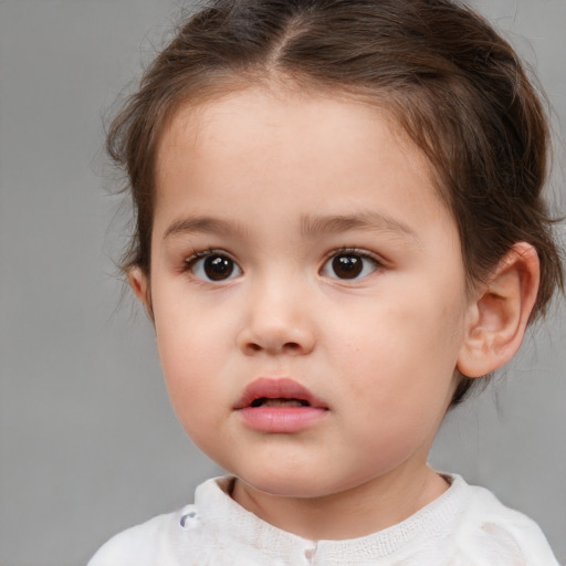 Neutral white child female with short  brown hair and brown eyes