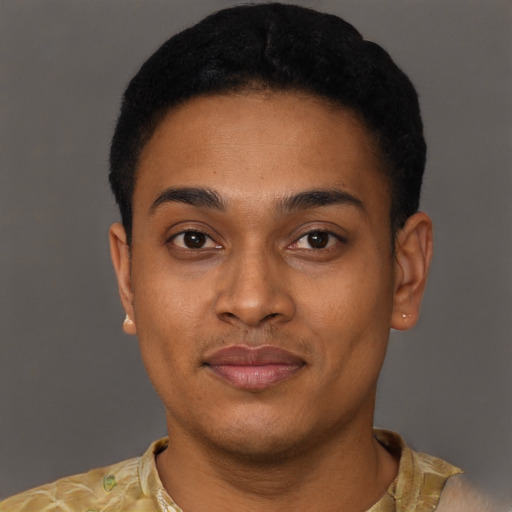 Joyful black young-adult male with short  brown hair and brown eyes