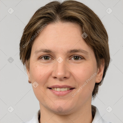 Joyful white adult female with medium  brown hair and grey eyes