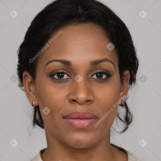 Joyful black adult female with medium  brown hair and brown eyes