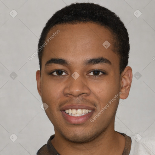 Joyful black young-adult male with short  brown hair and brown eyes