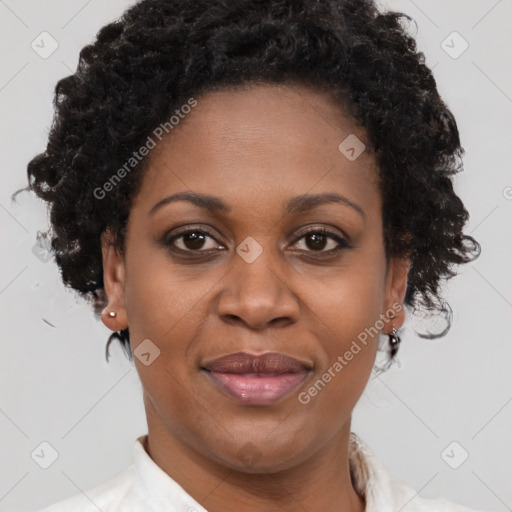 Joyful black adult female with short  brown hair and brown eyes