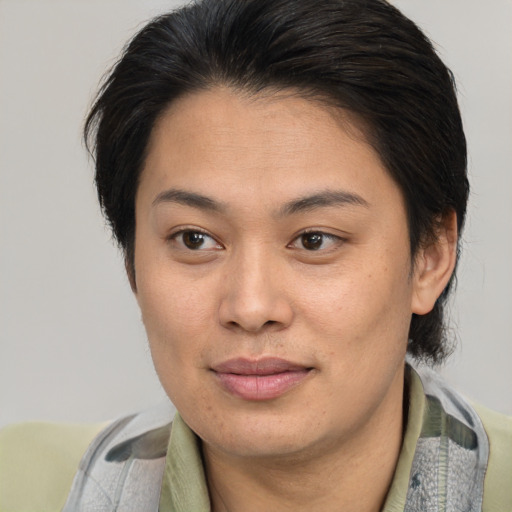 Joyful asian young-adult female with short  brown hair and brown eyes