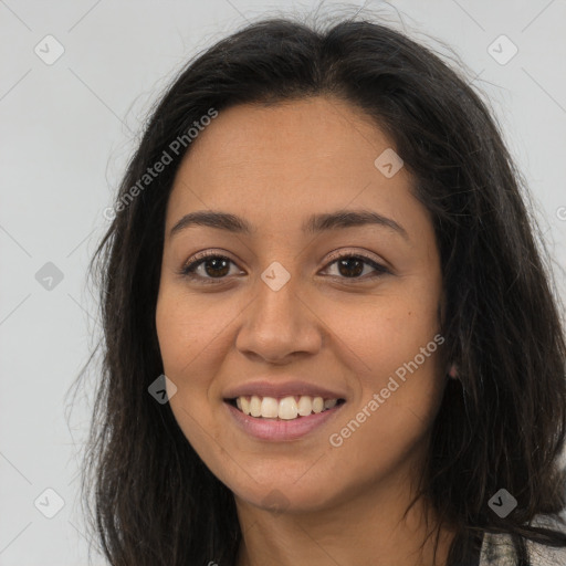 Joyful latino young-adult female with long  brown hair and brown eyes