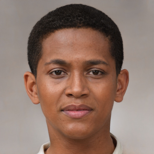 Joyful black young-adult male with short  brown hair and brown eyes