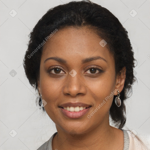 Joyful black young-adult female with medium  black hair and brown eyes