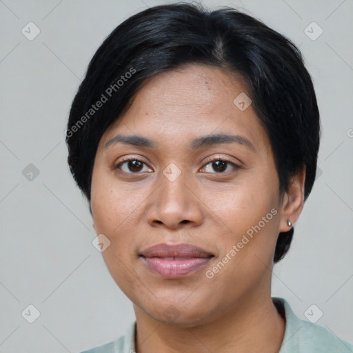 Joyful asian young-adult female with short  black hair and brown eyes