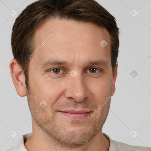 Joyful white adult male with short  brown hair and grey eyes